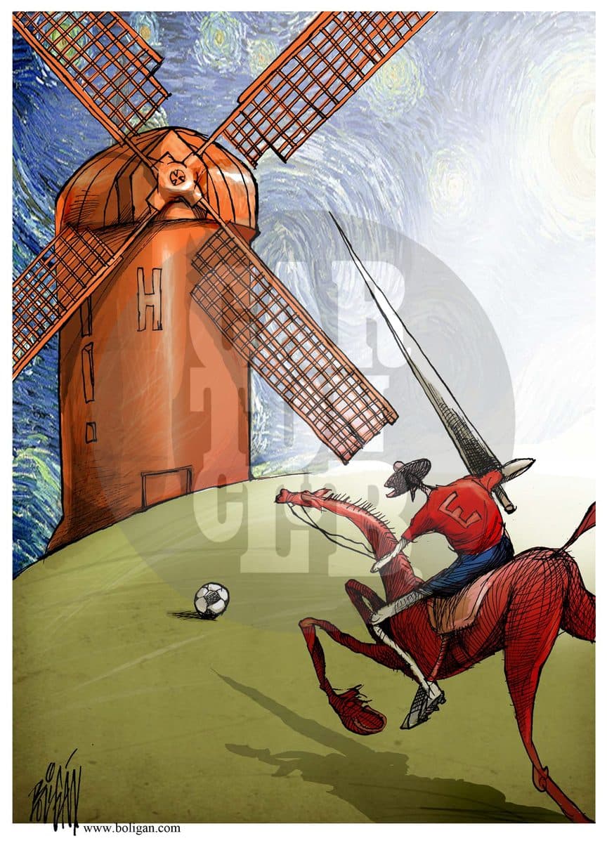 Un jinete con uniforme deportivo carga con una lanza contra un molino de viento junto a un balón de fútbol, en referencia al Quijote y al Mundial de fútbol.